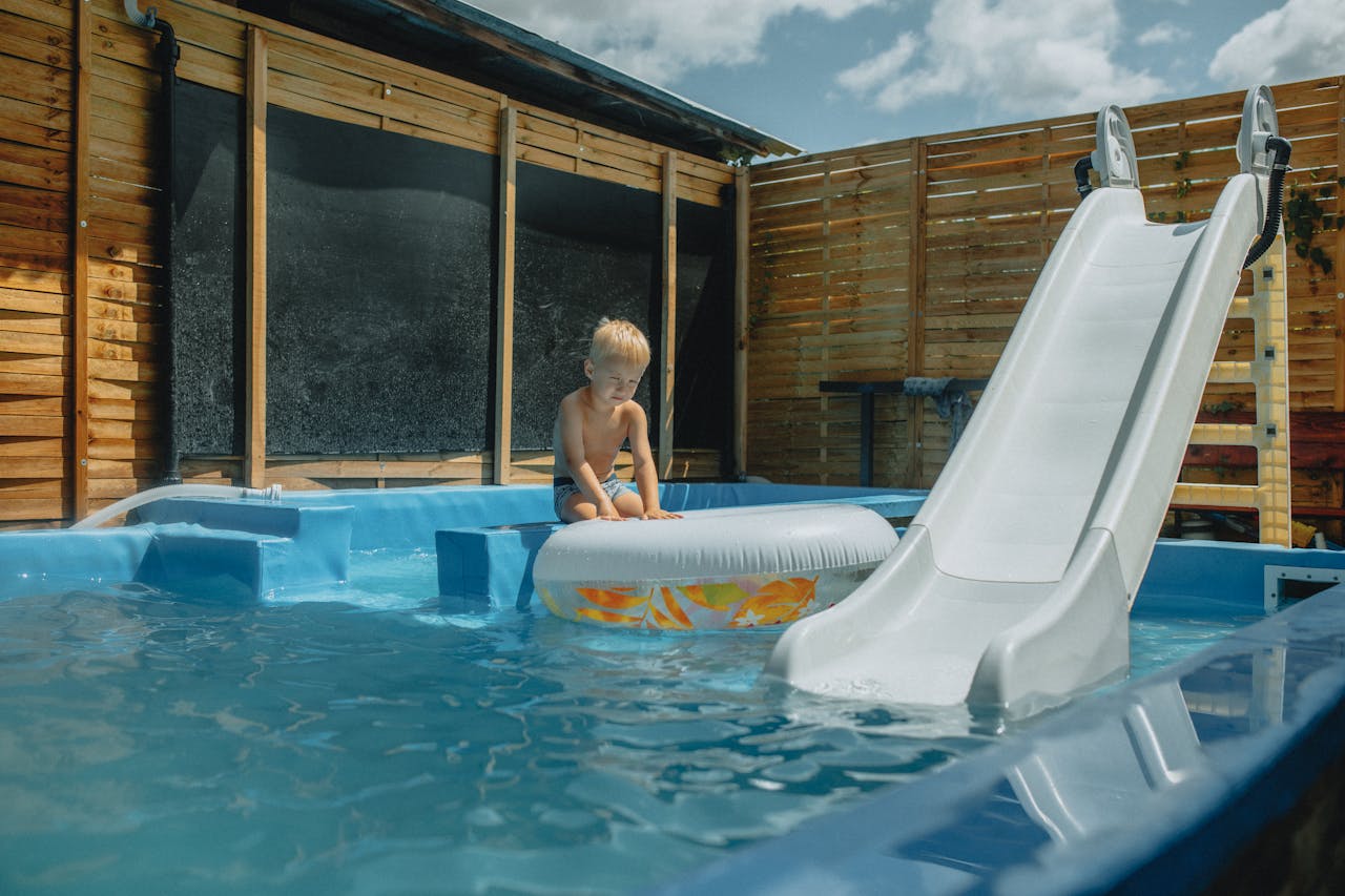 Family enjoying pool in summer